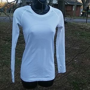 White Long sleeve woman's lululemon shirt.